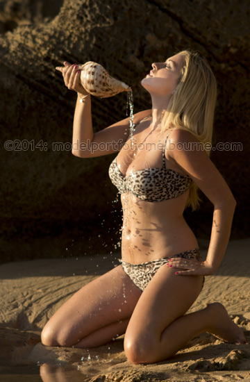 female model with conch shell